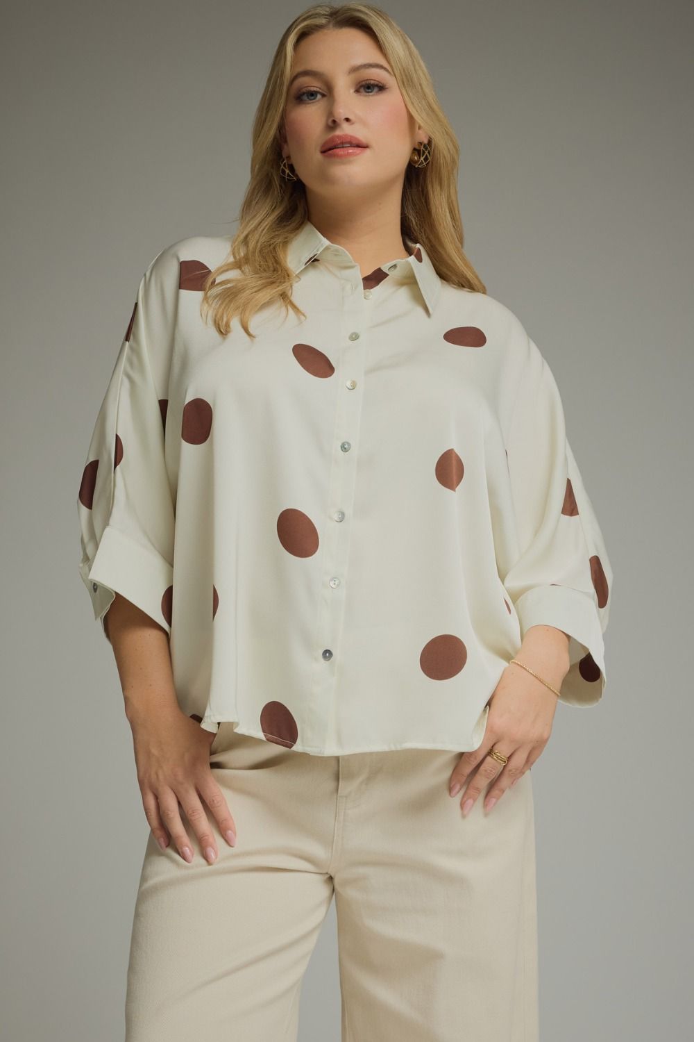 Plus size cream polka dot button-up blouse with oversized brown dots