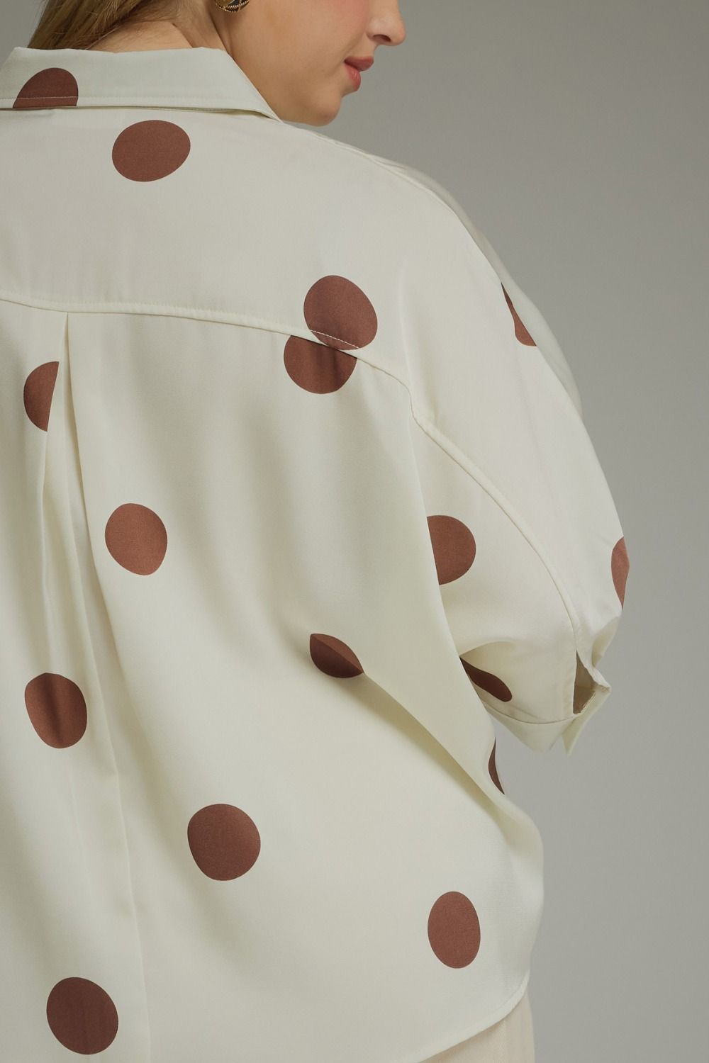 Women's plus size collared blouse featuring oversized polka dot print