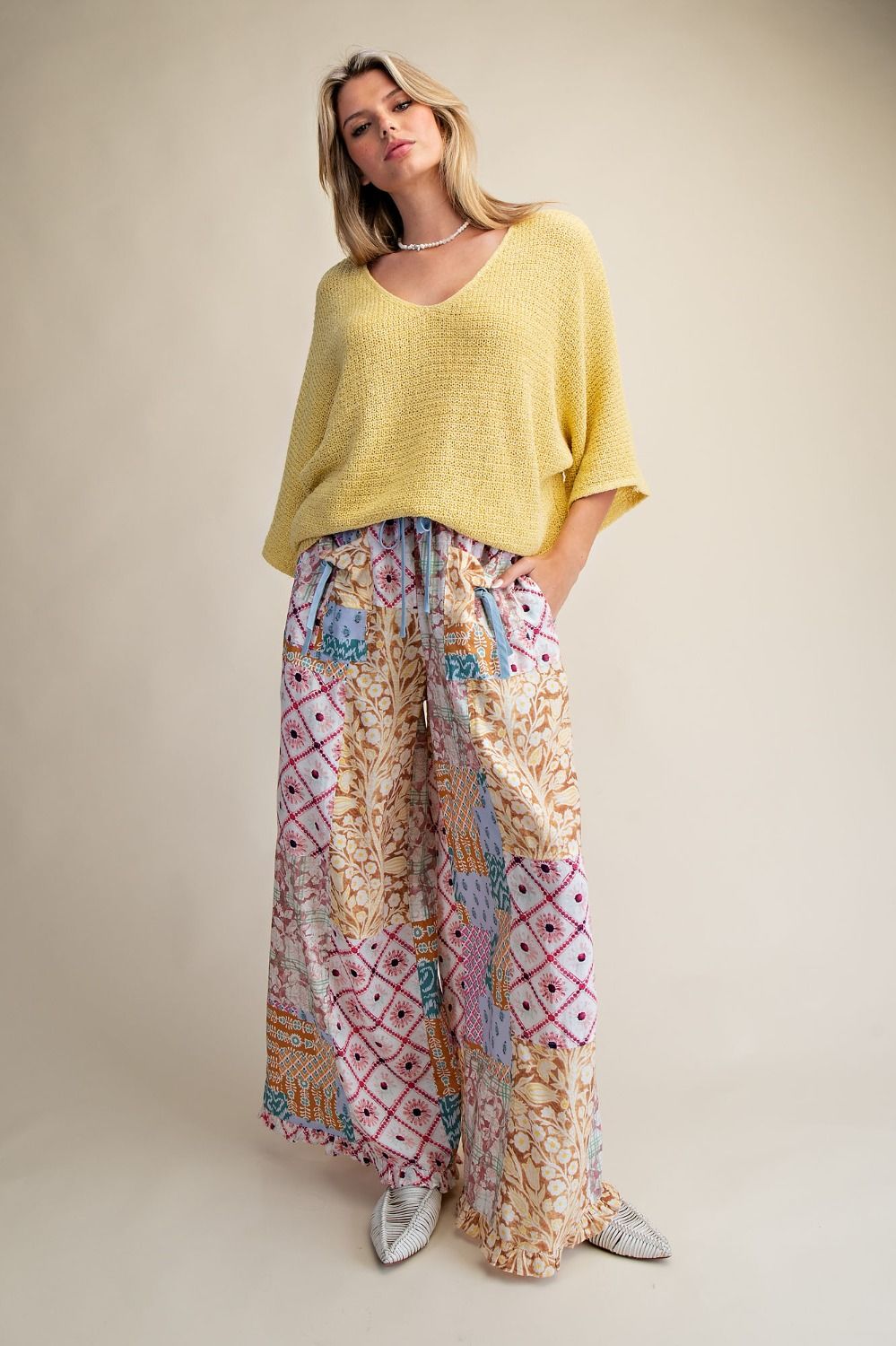 Oversized yellow knit top with a boat neck
