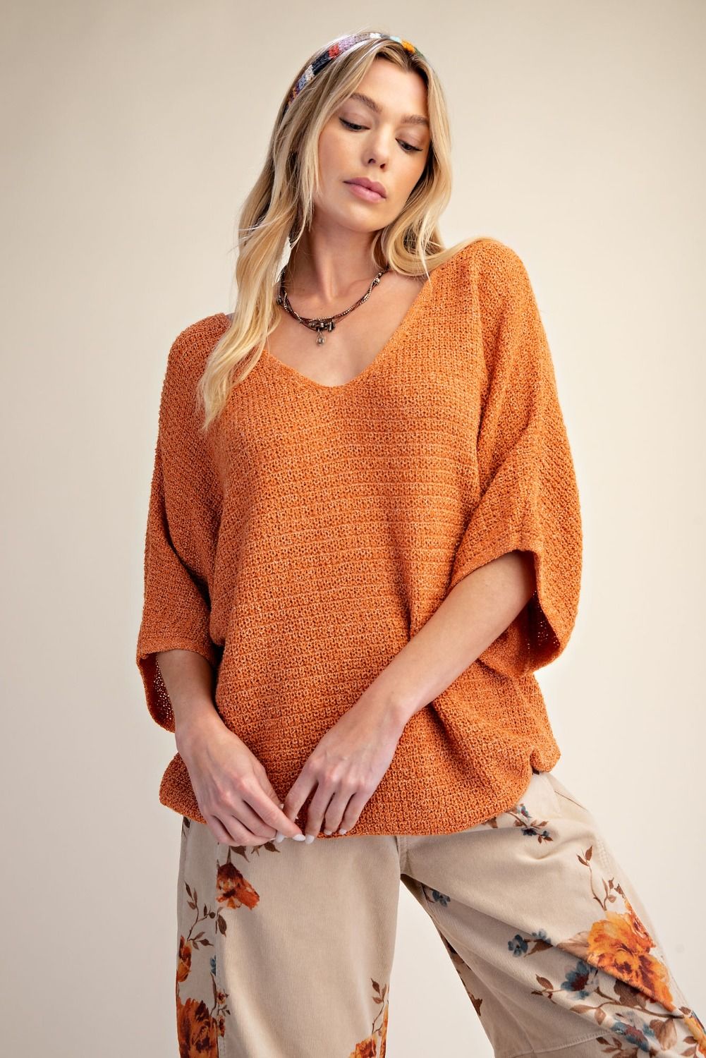 Oversized women’s knit top with quarter length sleeves