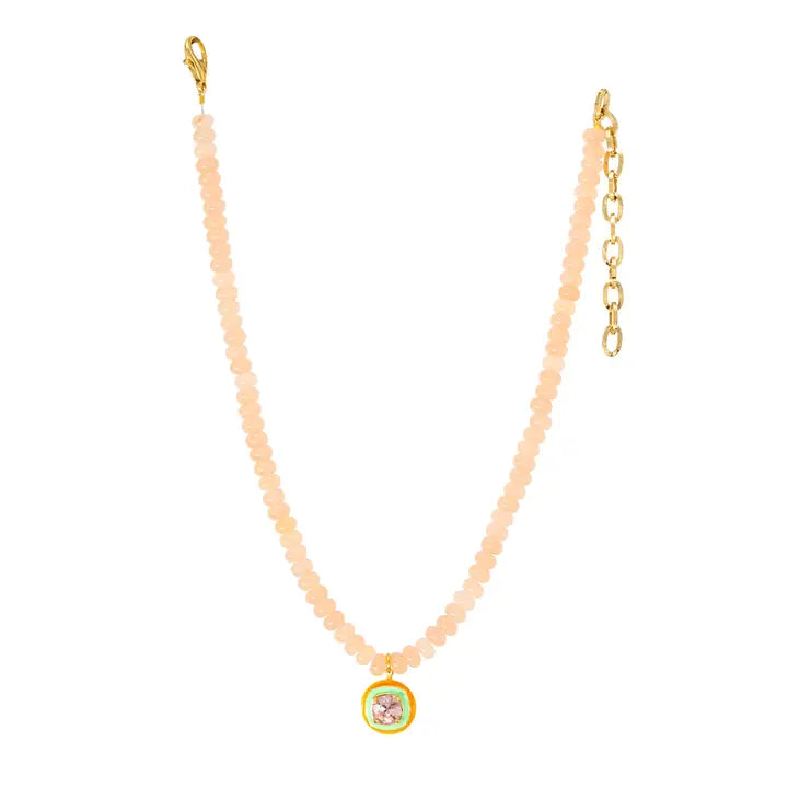 tova beaded necklace with a blue gemstone 