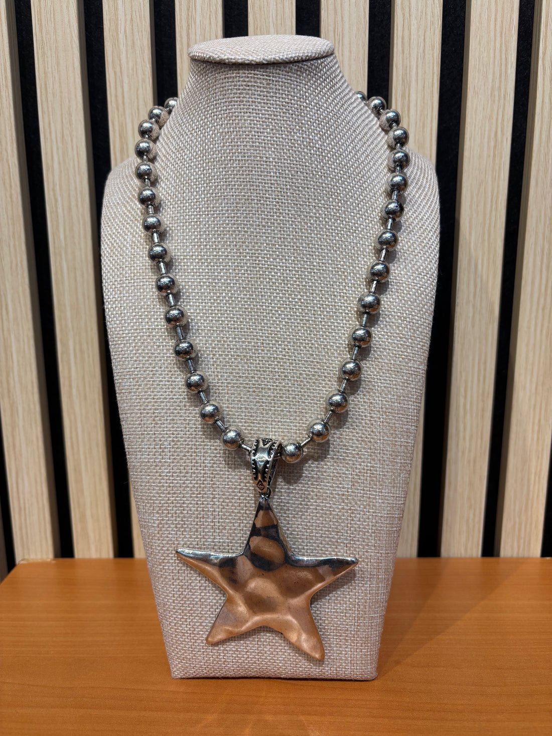 Gold chunky beaded necklace with a big star pendant 